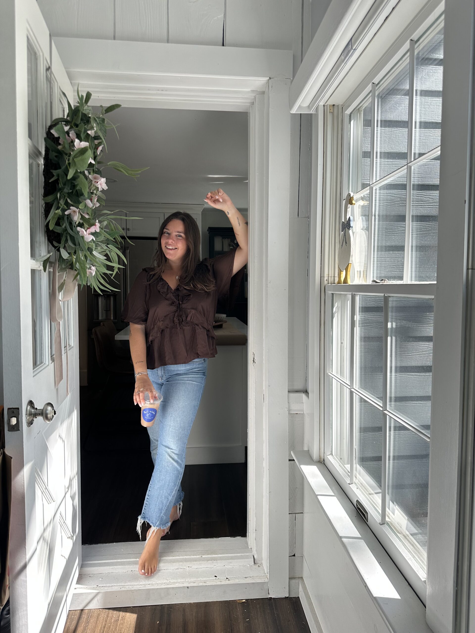 photo of copywriter Sara Joelle standing in a doorway